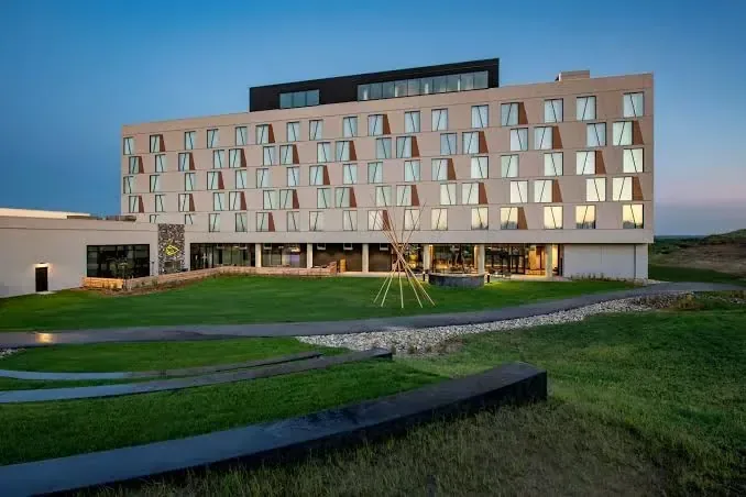 The exterior of Dakota Dunes Resort at dusk, Whitecap