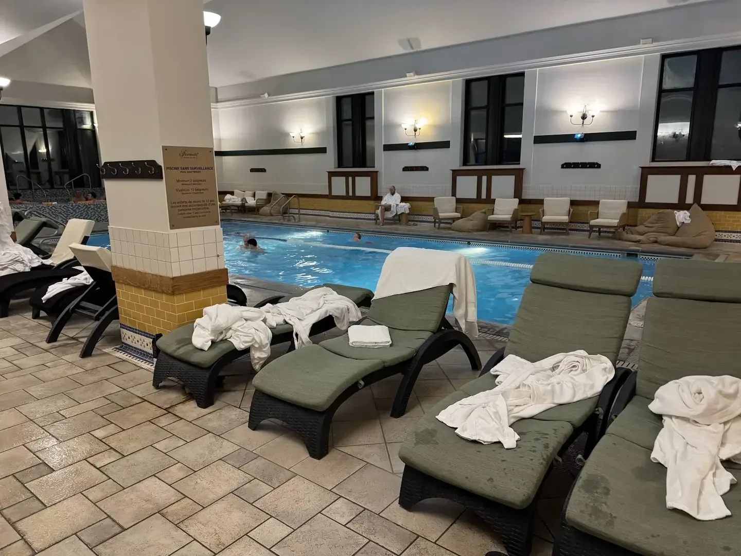 The indoor pool and loungers at Fairmont Le Manoir Richelieu, La Malbaie